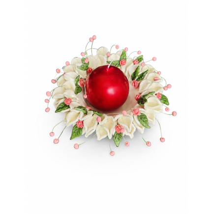 Ceramic candle holder with a red candle and floral wreath.