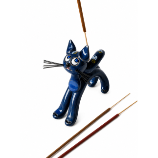 Handmade ceramic cat with blue accents.