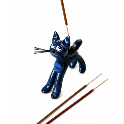 Handmade ceramic cat with blue accents.