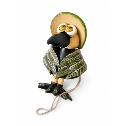 Handmade ceramic crow with a green hat.
