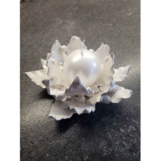 Ceramic candle holder with handcrafted leaves and pearl accents.