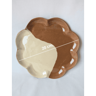Handcrafted brown and white clay plates inspired by delicate flower petals