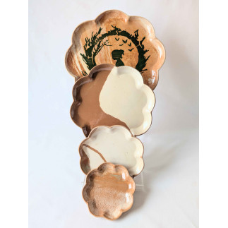 Set of four decorative flower clay plates with natural brown and white clay colors